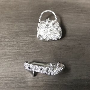 Silver purse and high heel pins